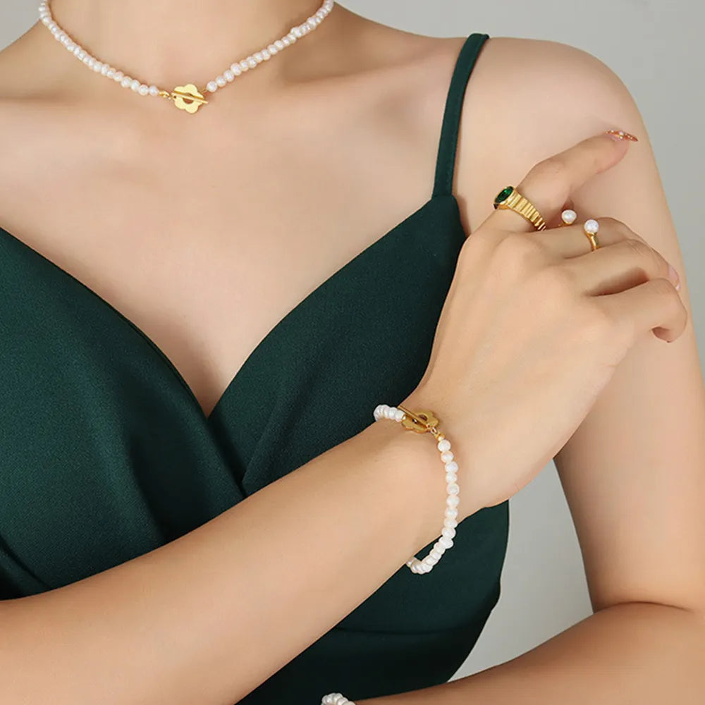 Delicate Women's Titanium Steel Pearl Flower Charm Bracelet.
