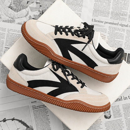 White sneakers with black and brown accents on a newspaper background