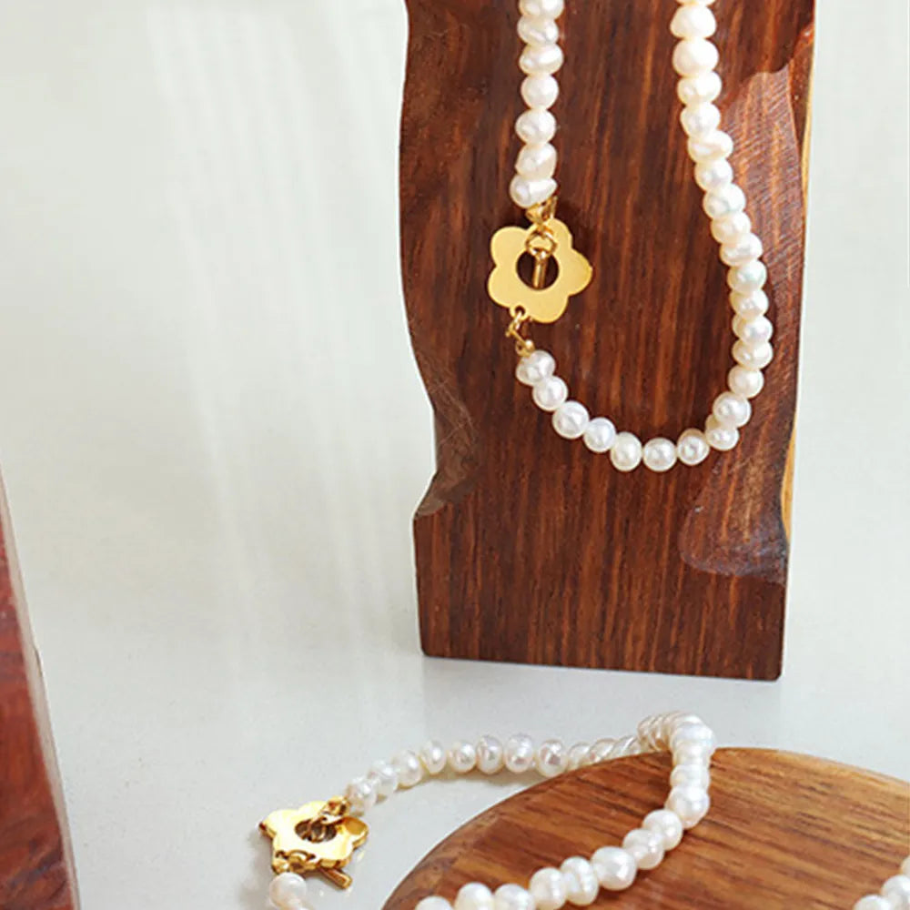 Delicate Women's Titanium Steel Pearl Flower Charm Bracelet.