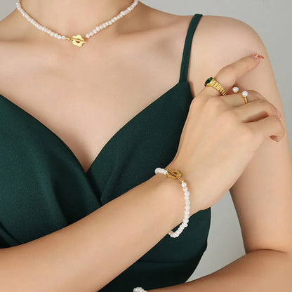 Delicate Women's Titanium Steel Pearl Flower Charm Bracelet.