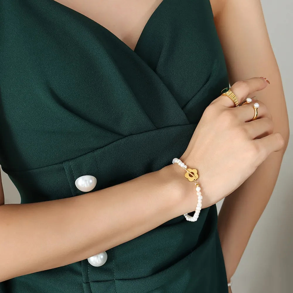 Delicate Women's Titanium Steel Pearl Flower Charm Bracelet.