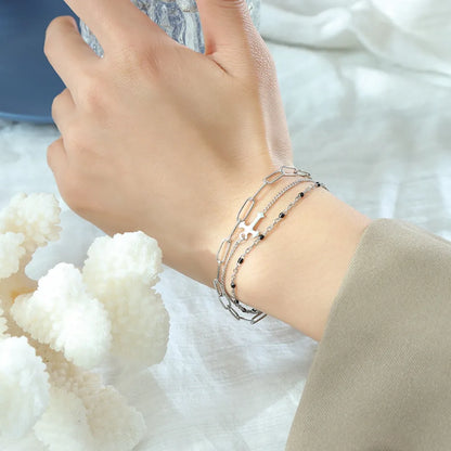 Minimalist Titanium Steel Three-Layered Chain and Bead Bracelet for Women.
