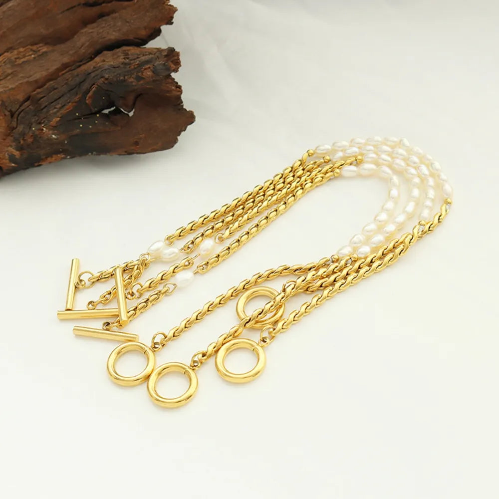 Luxury Women's Titanium Steel Stacked Bracelet with Delicate Pearl Strands.