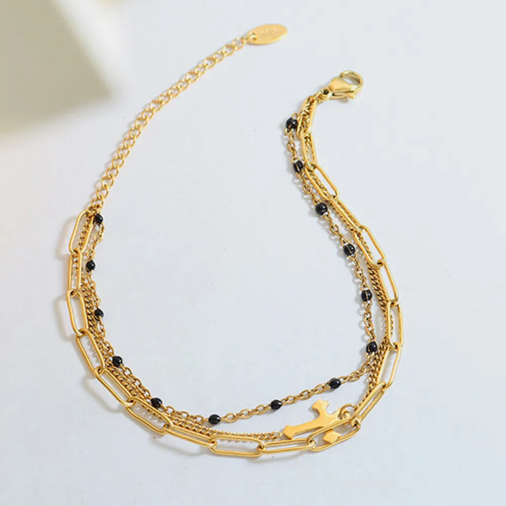 Minimalist Titanium Steel Three-Layered Chain and Bead Bracelet for Women.